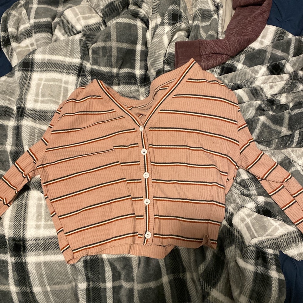 Stripped button up top.